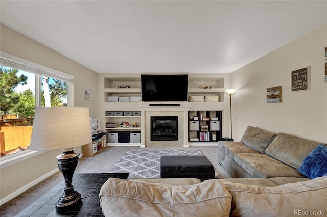 5415 Spruce Ave, Castle Rock, CO 80104 - living room with carpet, built in shelves, and a tile fireplace
