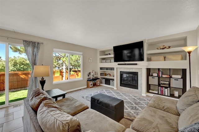 5415 Spruce Ave, Castle Rock, CO 80104 - living area featuring built in features and a tiled fireplace