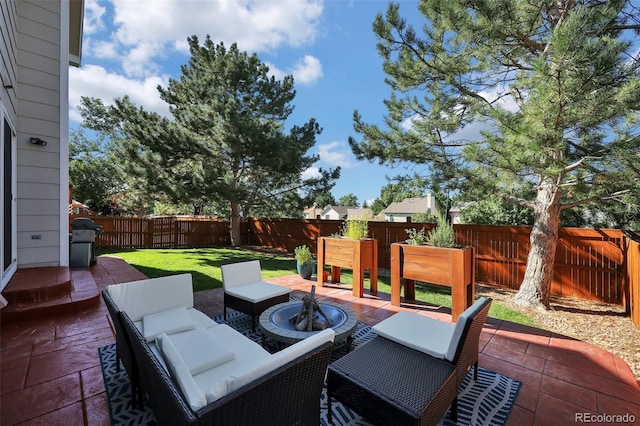 5415 Spruce Ave, Castle Rock, CO 80104 - fenced backyard with an outdoor fire pit and a patio area