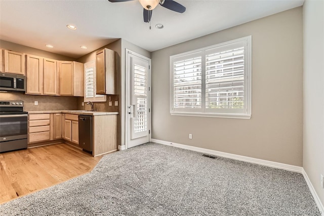 10311 Belvedere Ln, Lone Tree, CO 80124 - kitchen with stainless steel appliances, light brown cabinetry, a sink, baseboards, and recessed lighting