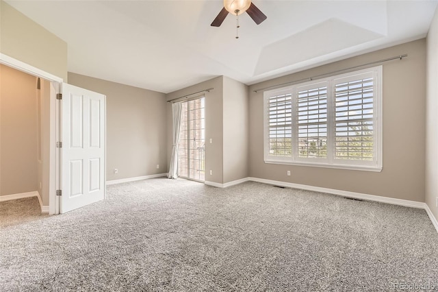 10311 Belvedere Ln, Lone Tree, CO 80124 - carpeted empty room with ceiling fan, baseboards, and a tray ceiling