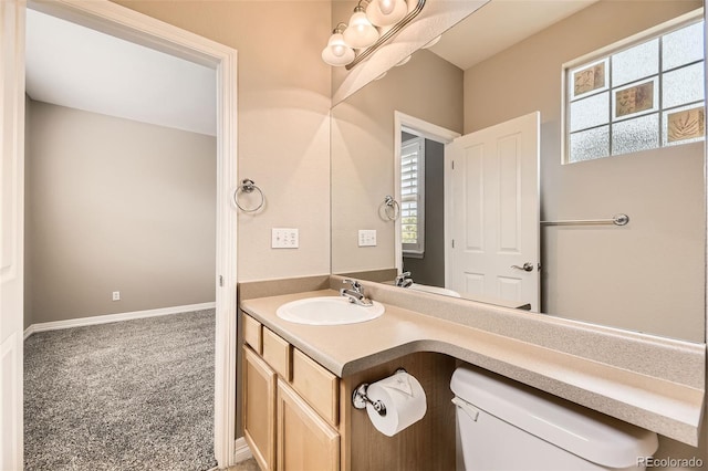 10311 Belvedere Ln, Lone Tree, CO 80124 - half bath featuring vanity, toilet, and baseboards