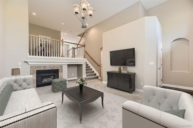 10311 Belvedere Ln, Lone Tree, CO 80124 - living room featuring stairway, a chandelier, recessed lighting, a tile fireplace, and carpet flooring
