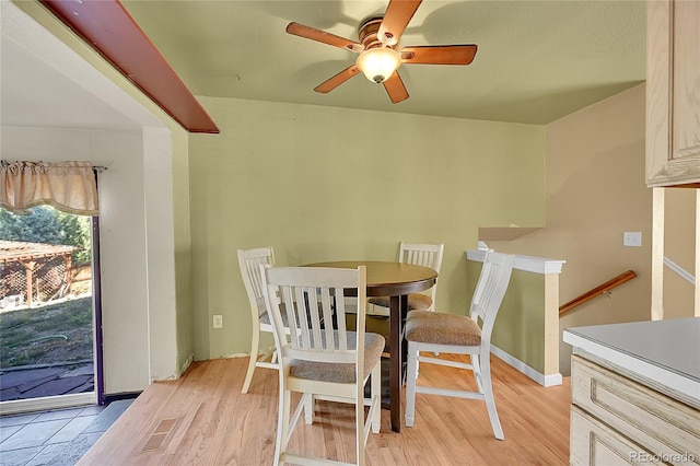 dining area featuring light hardwood / wood-style floors and ceiling fan