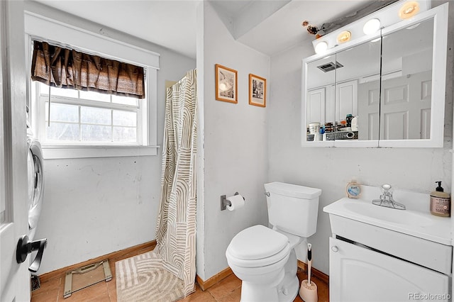 bathroom with vanity, toilet, and tile patterned floors