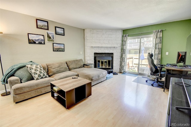 8022 S Columbine Ct, Centennial, CO 80122 - living area with wood finished floors, a desk, and a fireplace