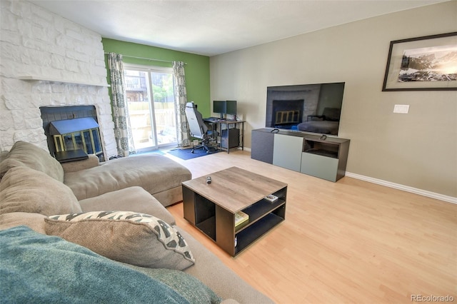 8022 S Columbine Ct, Centennial, CO 80122 - living area featuring a fireplace and wood finished floors