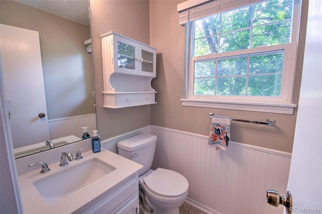 8022 S Columbine Ct, Centennial, CO 80122 - bathroom with a wainscoted wall, vanity, and wooden walls
