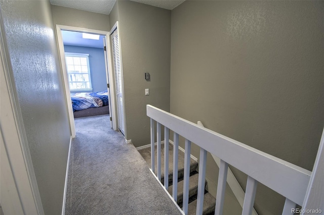 8022 S Columbine Ct, Centennial, CO 80122 - corridor with an upstairs landing, carpet floors, and a textured wall