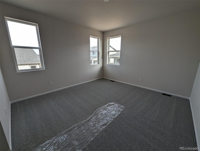 view of carpeted spare room