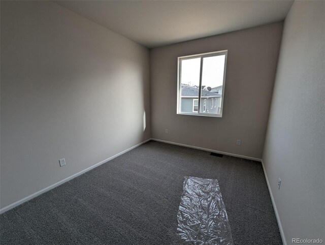 unfurnished room with carpet floors