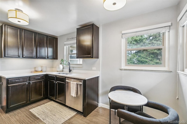 1060 S Harrison St, Denver, CO 80209 - kitchen featuring stainless steel dishwasher, plenty of natural light, light countertops, and light wood-style floors