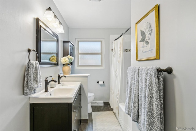1060 S Harrison St, Denver, CO 80209 - bathroom featuring double vanity, shower / bathtub combination with curtain, and wood finished floors