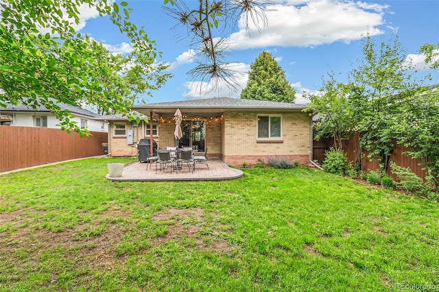1060 S Harrison St, Denver, CO 80209 - rear view of house featuring brick siding, a fenced backyard, and a patio