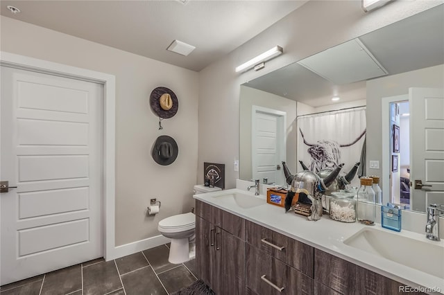 bathroom with toilet, vanity, tile patterned flooring, and a shower with shower curtain