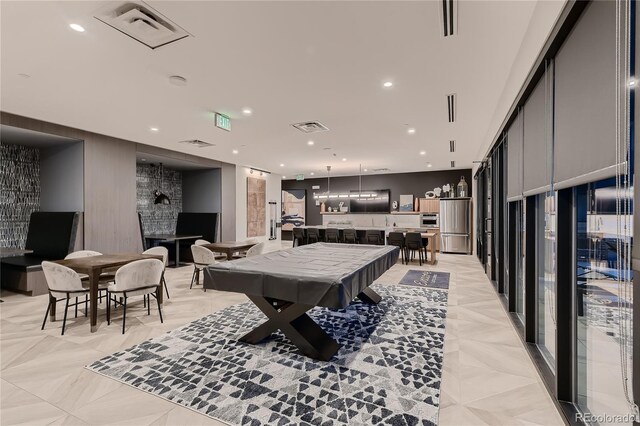 recreation room with bar area and a fireplace