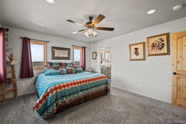 carpeted bedroom with ceiling fan and connected bathroom