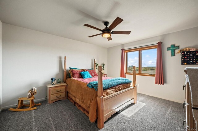 bedroom featuring ceiling fan and dark colored carpet