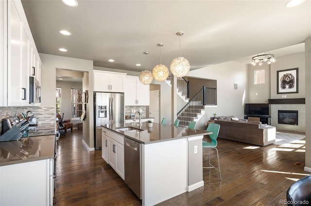 15194 W Washburn Ave, Lakewood, CO 80228 - kitchen featuring a chandelier, stainless steel appliances, recessed lighting, and backsplash