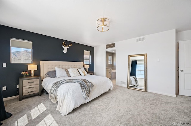 15194 W Washburn Ave, Lakewood, CO 80228 - carpeted bedroom with baseboards and connected bathroom