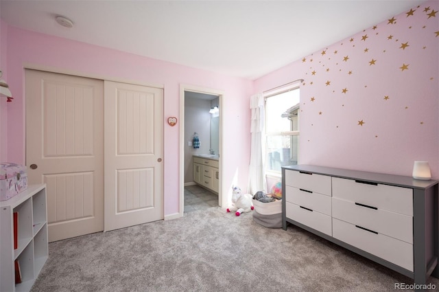 15194 W Washburn Ave, Lakewood, CO 80228 - carpeted bedroom with a closet and ensuite bath
