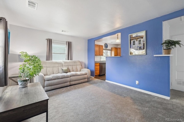 1995 Xenia St, Denver, CO 80220 - living room featuring visible vents, baseboards, and carpet floors