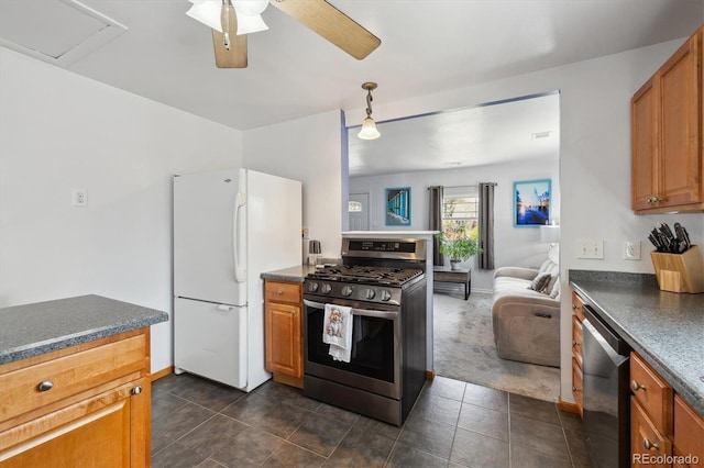 1995 Xenia St, Denver, CO 80220 - kitchen featuring dishwashing machine, dark countertops, freestanding refrigerator, and stainless steel gas stove