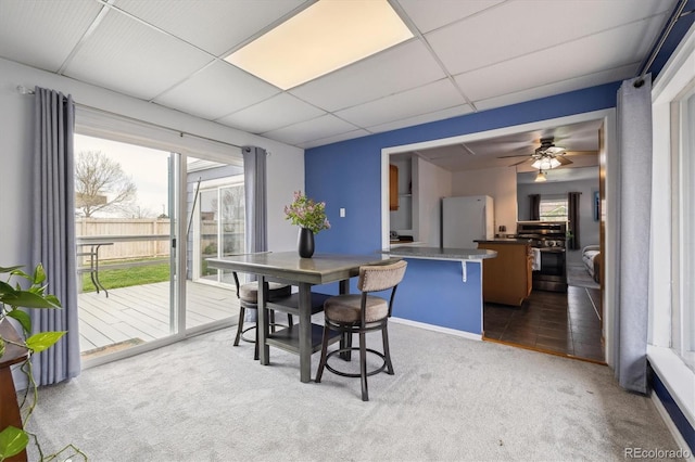 1995 Xenia St, Denver, CO 80220 - dining space featuring carpet floors, a ceiling fan, baseboards, and a paneled ceiling