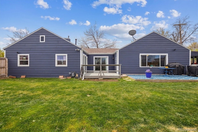 1995 Xenia St, Denver, CO 80220 - back of house featuring fence, a wooden deck, and a yard