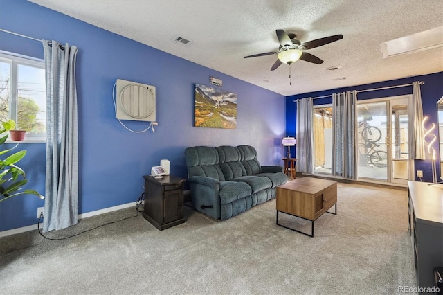 1995 Xenia St, Denver, CO 80220 - carpeted living room featuring a ceiling fan, a textured ceiling, visible vents, and baseboards