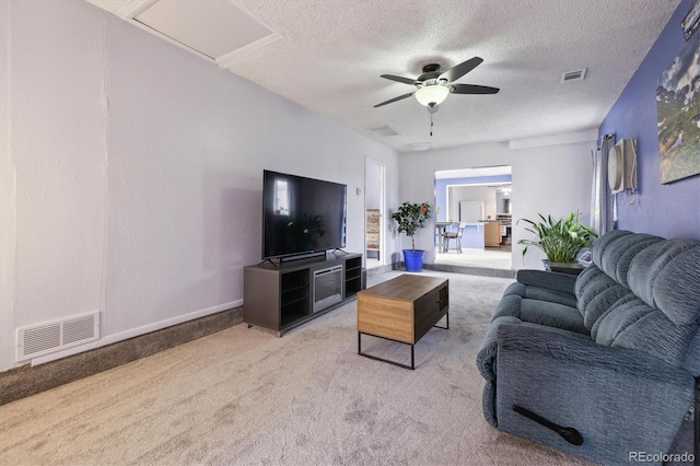 1995 Xenia St, Denver, CO 80220 - living room with carpet flooring, a textured ceiling, ceiling fan, and visible vents