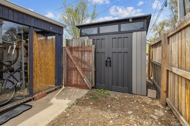 1995 Xenia St, Denver, CO 80220 - view of shed featuring a gate and a fenced backyard
