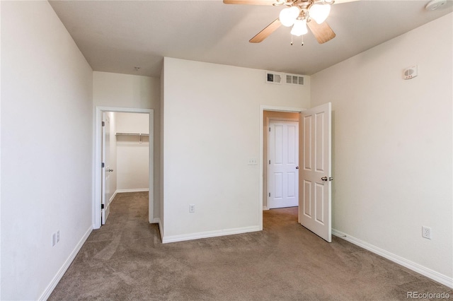 804 Summer Hawk Dr Unit 3202, Longmont, CO 80504 - unfurnished bedroom featuring carpet flooring, a spacious closet, and a ceiling fan