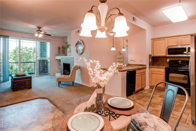 804 Summer Hawk Dr Unit 3202, Longmont, CO 80504 - dining area featuring light carpet, a ceiling fan, a fireplace, and a chandelier