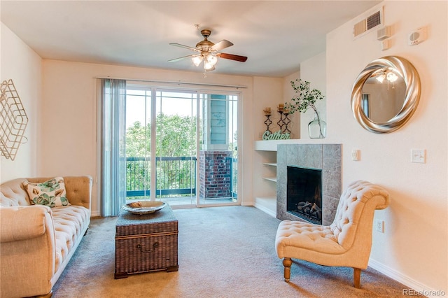 804 Summer Hawk Dr Unit 3202, Longmont, CO 80504 - carpeted living area featuring a ceiling fan and a tiled fireplace