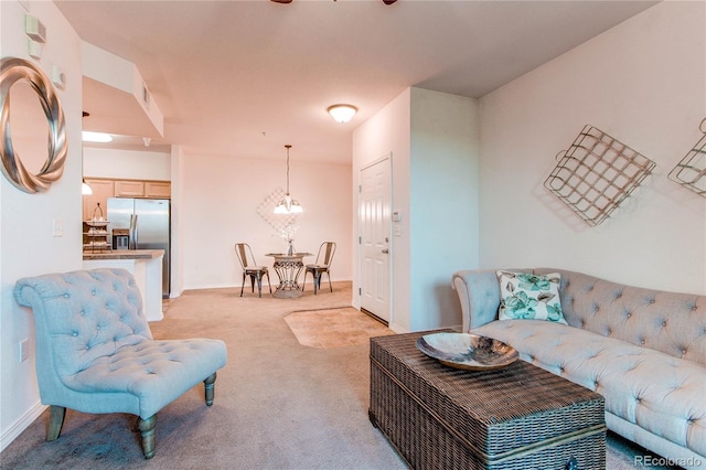 804 Summer Hawk Dr Unit 3202, Longmont, CO 80504 - living room with light colored carpet and a chandelier