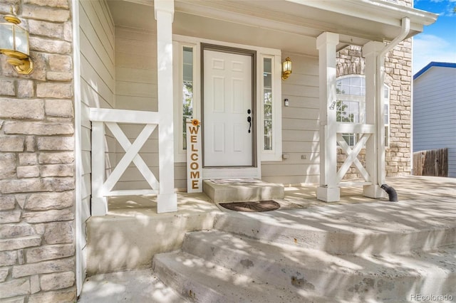 524 Rider Ridge Dr, Longmont, CO 80504 - view of exterior entry with stone siding and covered porch