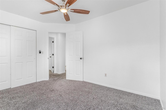 524 Rider Ridge Dr, Longmont, CO 80504 - unfurnished bedroom with a closet, baseboards, a ceiling fan, and carpet floors