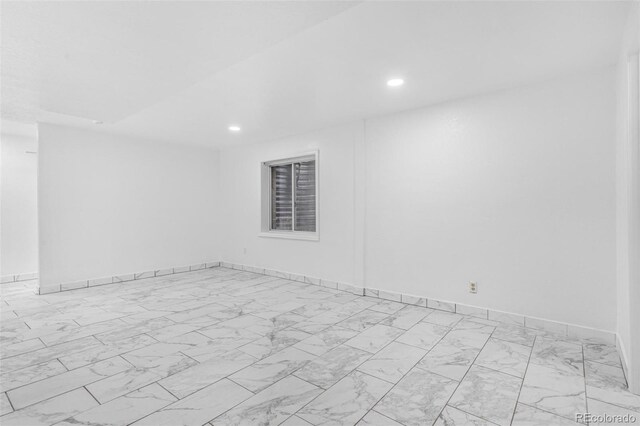 524 Rider Ridge Dr, Longmont, CO 80504 - spare room featuring baseboards, marble finish floor, and recessed lighting