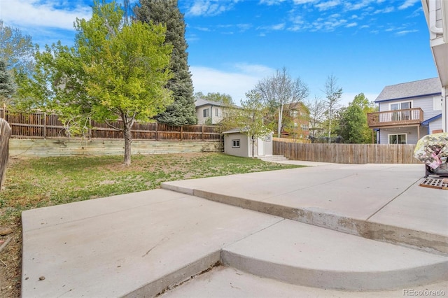 524 Rider Ridge Dr, Longmont, CO 80504 - view of patio / terrace with a storage shed, an outbuilding, and a fenced backyard