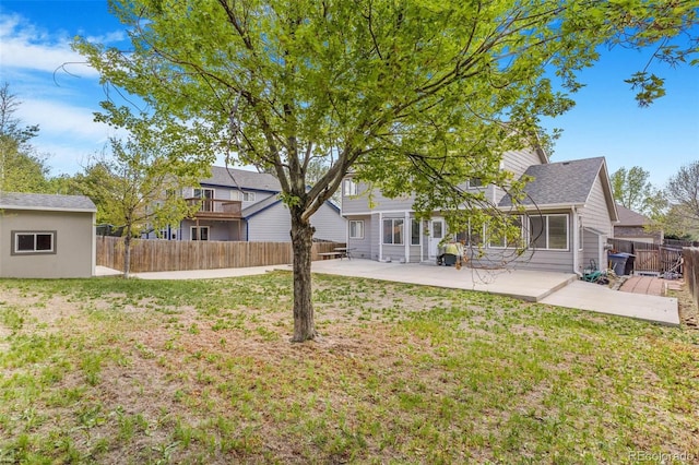 524 Rider Ridge Dr, Longmont, CO 80504 - back of property featuring a yard, a patio, and a fenced backyard
