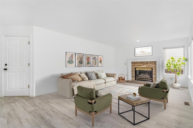 524 Rider Ridge Dr, Longmont, CO 80504 - living area featuring light wood-style floors, a fireplace, and baseboards