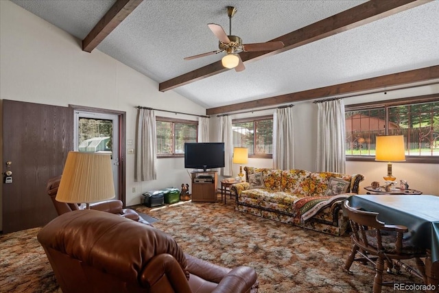 carpeted living room with ceiling fan, a healthy amount of sunlight, vaulted ceiling with beams, and a textured ceiling