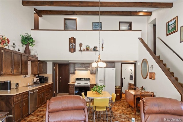 living room with beamed ceiling and sink