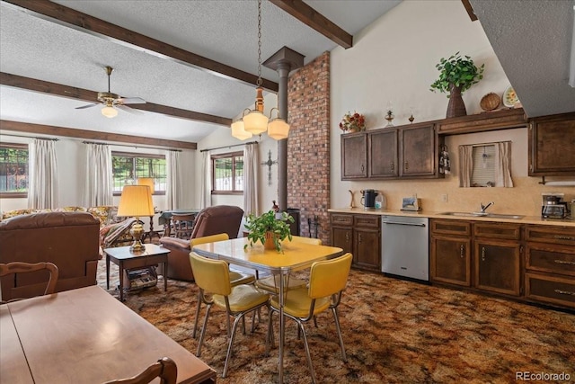 kitchen with lofted ceiling with beams, a healthy amount of sunlight, dark carpet, and stainless steel dishwasher