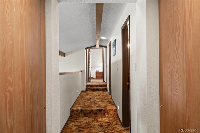 hallway with a textured ceiling