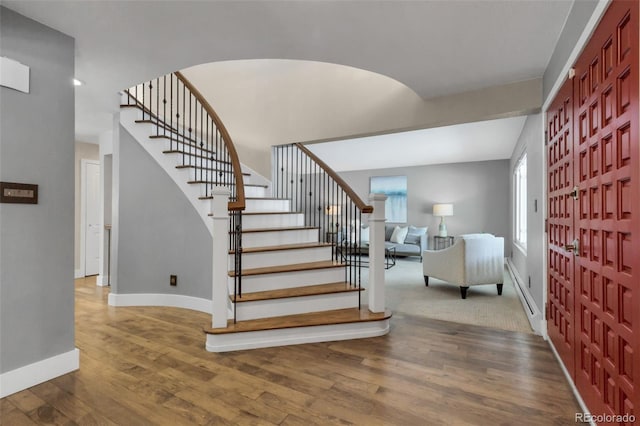 staircase with wood-type flooring