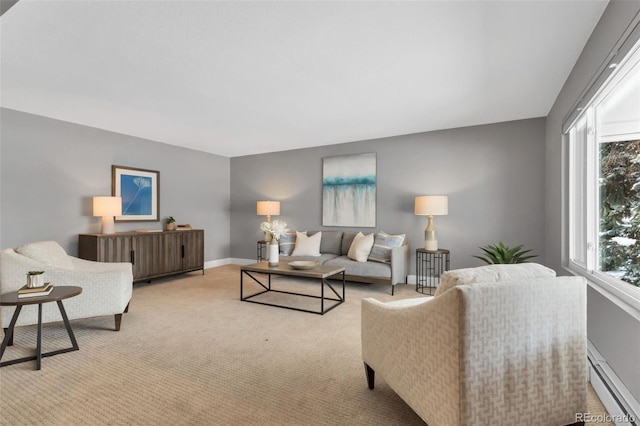 living room featuring baseboard heating and light carpet