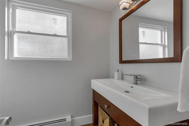 bathroom featuring vanity and baseboard heating