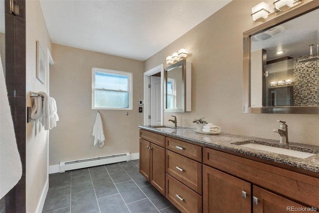 bathroom featuring tile patterned floors, walk in shower, vanity, and a baseboard heating unit